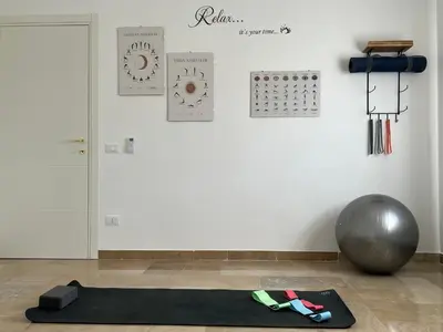 a black yoga mat on the floor in a room at TramQuility House in Palermo