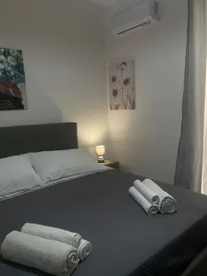 a bedroom with a bed with two towels on it at Altri tempi in Palermo