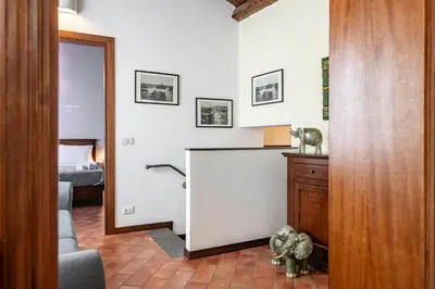 a living room with a counter and a room with a bed at GuestHost - MiraVigghia Apartment in Palermo