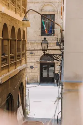 an alley in a building with a street light at Serenello Home in Palermo