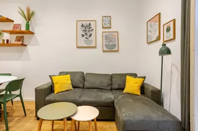 a living room with a couch and two tables at Casa Vacanza Dante 17 Carini in Carini
