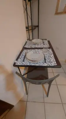 a table with two plates on top of it at Casa dei normanni in Palermo