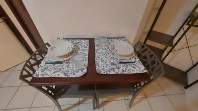 a table with a bowl and plates on it at Casa dei normanni in Palermo