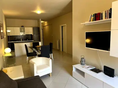 a living room with a couch and a dining room at Belmonte 18 in Palermo