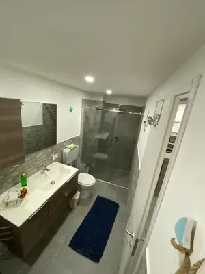 a bathroom with a shower and a sink and a toilet at Il sole siciliano in Palermo