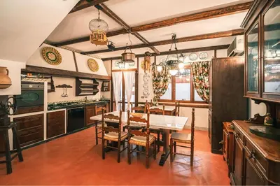 a kitchen with a table and chairs in a room at Le Sicilien - Villa Harmony - Relax a Mondello in Palermo