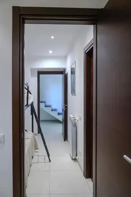 a hallway with a door leading to a room with stairs at CELSO E SAITTA per SAITTA HOLIDAYS in Palermo