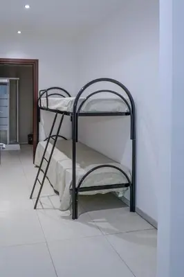 a couple of bunk beds in a room at CELSO E SAITTA per SAITTA HOLIDAYS in Palermo