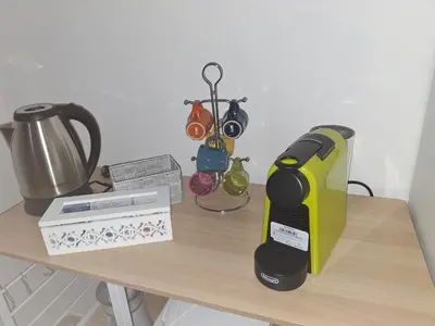 a table with a blender and a box on it at Mondello House29 in Palermo