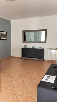 a room with a mirror on the wall at Il mare negli occhi in Porticello