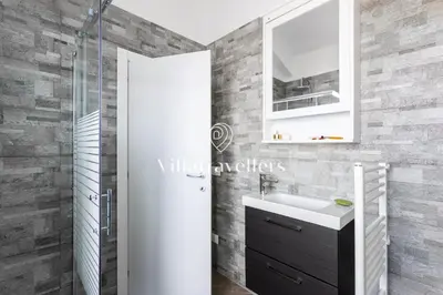 a bathroom with a sink and a shower at Cava in Scopello
