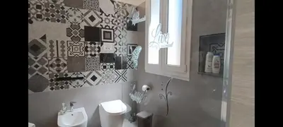 a bathroom with a sink and a toilet at La Casa Del Vecchio Borgo in Palermo