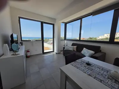 a living room with a couch and a table at A Casa di Angela in Capaci