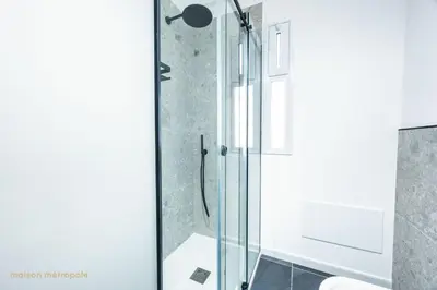 a bathroom with a shower with a glass door at Calatafimi House in Palermo