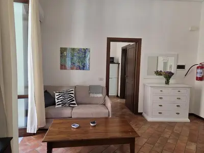 a living room with a couch and a table at A Casa di Iside in Palermo