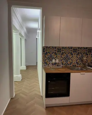 a kitchen with a sink and a counter top at Ai Limoni in Palermo