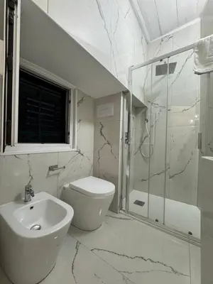a bathroom with a sink and a toilet and a shower at Ai Limoni in Palermo