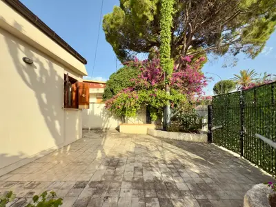 a driveway of a house with a fence at Merlo Holiday Homes Mare in Trabia