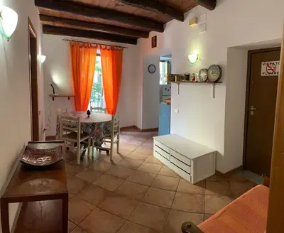 a living room with a table and a dining room at Casa Ballarò Centro Storico in Palermo