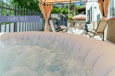 a hot tub with water inside of it at Baida Apartments in Palermo