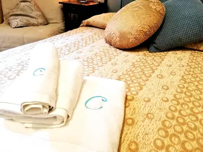 a bed with two towels on top of it at B&B Centro900 in Palermo