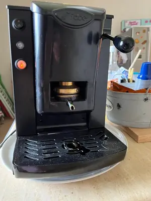 a black coffee maker sitting on a table at Villa Giulia Maria in Alcamo