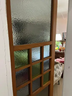 a door with glass panels in a room at Villa Giulia Maria in Alcamo