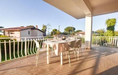 a table and chairs sitting on a deck at Villa Anastasia in Partinico