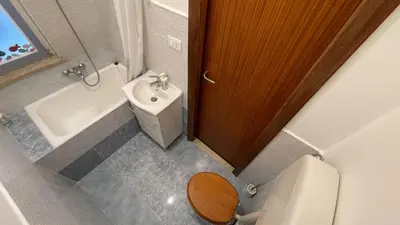 a small bathroom with a toilet and a sink at Villafranca33 - Politeama Centro Palermo in Palermo