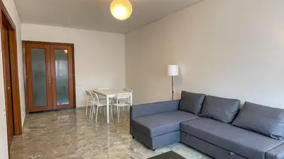 a living room with a couch and a table at Villafranca33 - Politeama Centro Palermo in Palermo