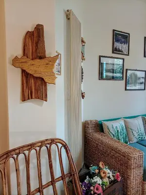 a living room with a crib and a couch at Sea View Holiday in Altavilla Milicia