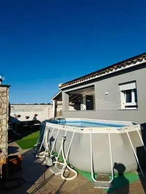 a swimming pool in front of a house at Casa Nadiia in Cinisi