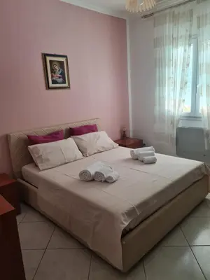 a bedroom with a large bed with towels on it at Casa Nadiia in Cinisi