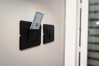 a nintendo wii controller is plugged into a wall outlet at Acqua Marina Balestrate in Balestrate