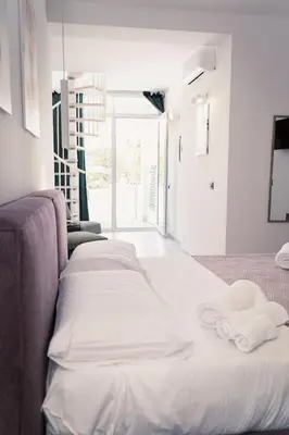 two beds in a room with towels on them at Acqua Marina Balestrate in Balestrate