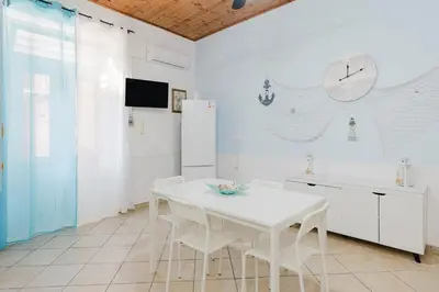 a bedroom with two beds and a turtle pillow at Perla Marina in Trappeto