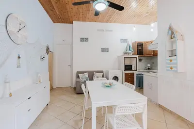 a bathroom with a sink and a toilet and a shower at Perla Marina in Trappeto