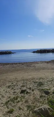 an empty beach with the ocean in the background at Da Sandra in Trabia