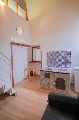a living room with a fireplace in a room at Himera Domus 2 in Termini Imerese