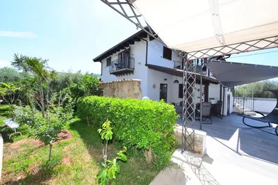 a view of a house from the back yard at M&G Holiday House in Terrasini