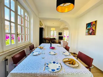 a living room with two couches and a piano at Villa Crilulù al Mare in Palermo