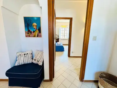 a living room with a table and chairs at Villa Crilulù al Mare in Palermo