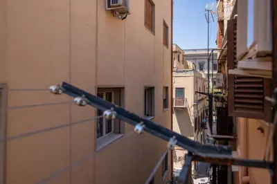 a view of an alley from a building at GuestHost - Don Pippo Flat near Teatro Massimo in Palermo