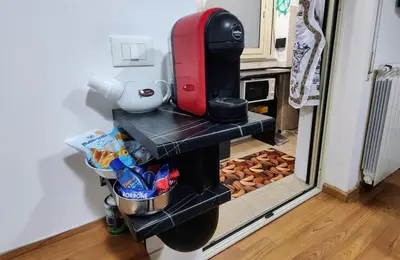 a coffee maker on a shelf in a kitchen at Roccaforte House - Palermo in Palermo