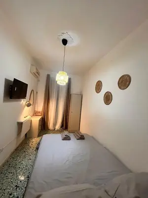 a bedroom with a large bed and a window at Porte Rosse in Casteldaccia