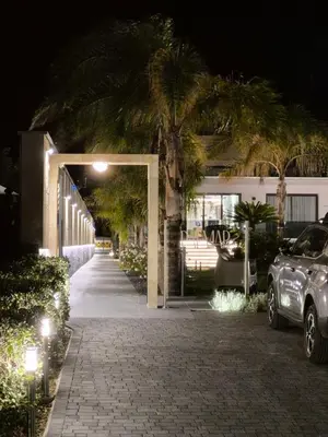 a car parked in front of a building at night at Palmar Boutique Hotel in Campofelice di Roccella