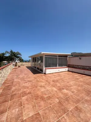 a large patio with a building on top of it at Oasi Palma - Mondello in Palermo