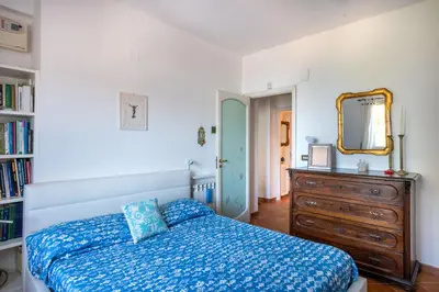 a bedroom with a bed and a dresser and a mirror at Casa Annibale con Vista Mare by Wonderful Italy in Palermo