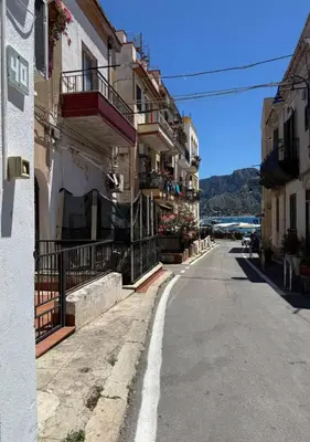 an empty street in a town with buildings at DomusSolis - Casa vacanza a 2 passi dal mare in Palermo