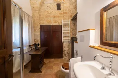 a bathroom with a sink and a toilet at Villa Cannamele in Carini